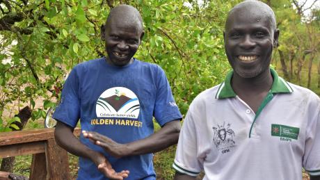 Refugee farmers, Andrew and David producing a golden harvest