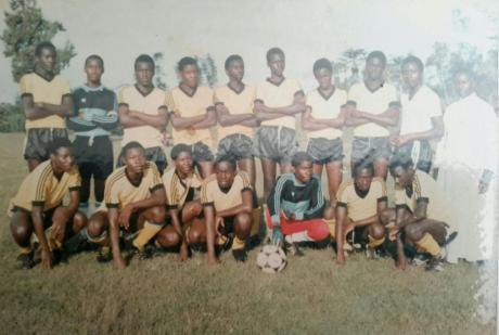 Michael Mukasa plays football in his school team