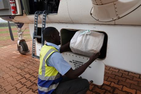 Ronnie a MAF ground Ops handler loads mobile lab onto 5X-SCO