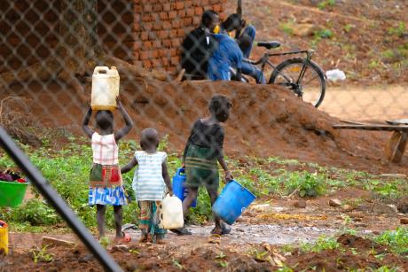 Refugee children fetching water