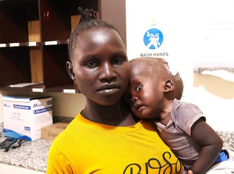 Ide Harriet with her son Godfrey Matale