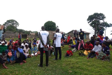 Missionaries address islanders who were waiting to receive treatment 